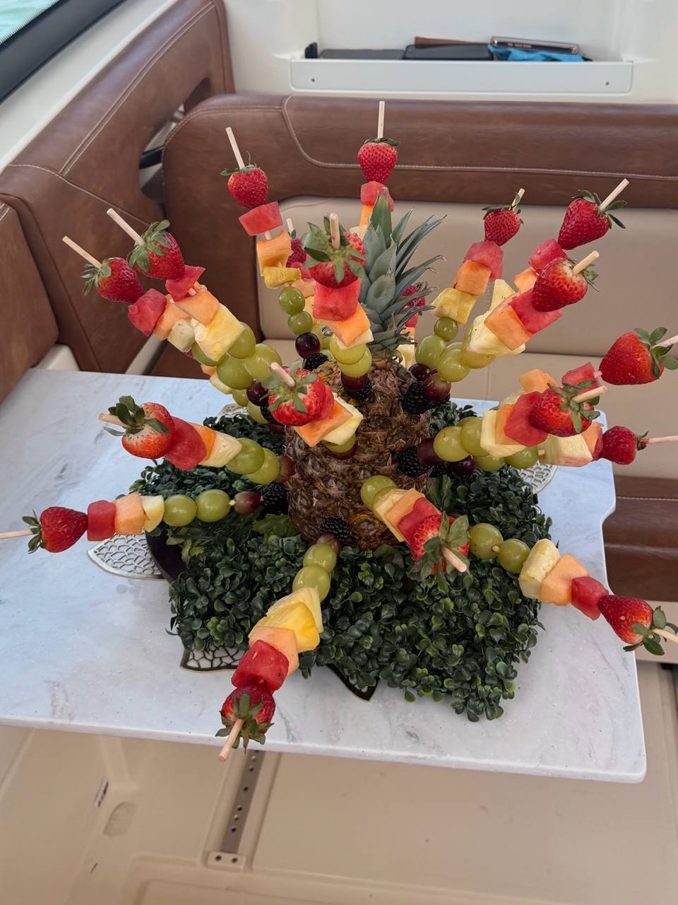 Tropical fruit display prepared for guests aboard a charter boat