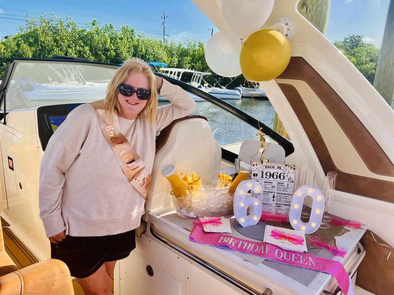 Birthday celebration aboard The Bougie Girl with balloons and a decorated drink setup