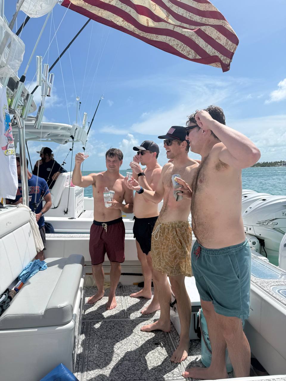 Guests celebrating with an American flag on a group charter in Islamorada