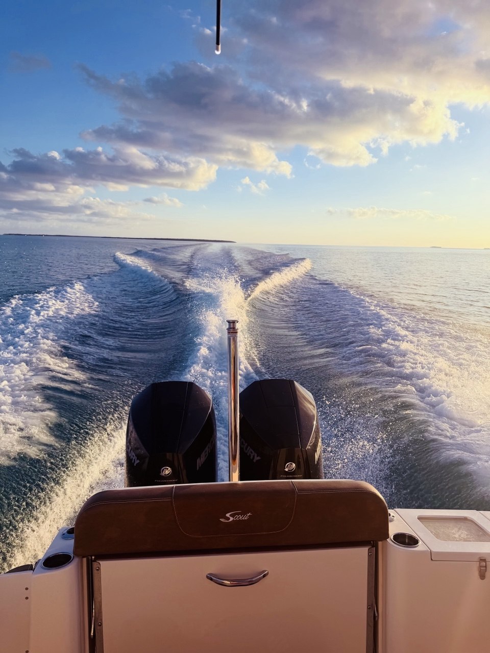 Golden sunset light over the wake of The Bougie Girl